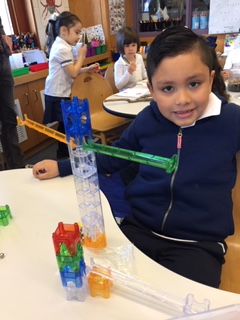 8 “This is my person ramp. The marble drops from the persons head and travels down through the body while I run two marbles from both arms. One marbles touches the heart on its way down. All marbles roll down the leg into the foot Ms.Ali